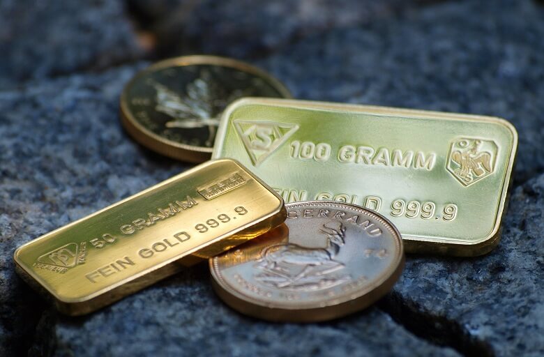 Goldbarren und Goldmünzen